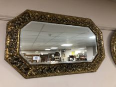 An early twentieth century brass embossed mirror