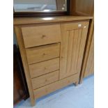 A beech effect double door wardrobe and linen cabinet