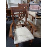 A pair of contemporary carved armchairs