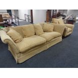 A three seater drop end settee with matching armchair in two-tone gold fabric CONDITION