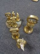 A collection of brass weights,