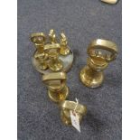 A collection of brass weights,