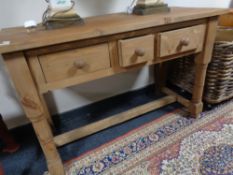 A rustic reclaimed pine three drawer side table 117 cm x 76 cm x 53 cm