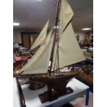 A vintage wooden pond yacht on stand CONDITION REPORT: Approximately 96cm long by
