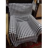 A contemporary black and white printed armchair