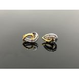 A pair of 10ct two-tone gold diamond earrings