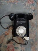 An early twentieth century black Bakelite telephone