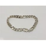 A silver curb link bracelet, length 22cm CONDITION REPORT: 31.
