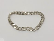 A silver curb link bracelet, length 22cm CONDITION REPORT: 31.