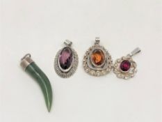 Four silver gemstone pendants
