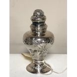 A small silver pepper pot