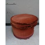 A circular footstool