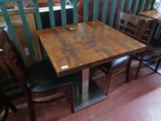 A cafe table together with a pair of wooden chairs (3)