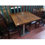 A cafe table together with a pair of wooden chairs (3)