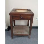 A Victorian mahogany stand fitted a drawer and undershelf