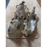 A tray of three decorative figures,