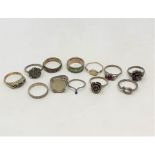 Twelve various silver rings