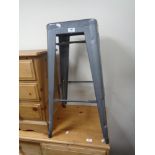 A metal bar stool