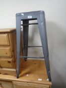 A metal bar stool