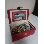 A box of costume jewellery, earrings,
