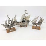 Three Italian silver models of sailing ships on wooden plinths,