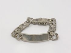 A heavy textured silver identify bracelet, length 20cm CONDITION REPORT: 65.