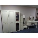 A five piece cream and gilt bedroom suite