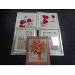 A pair of framed hand stitched panels of poppies,