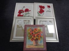 A pair of framed hand stitched panels of poppies,