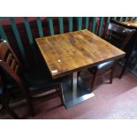 A cafe table together with a pair of wooden chairs (3)