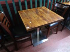 A cafe table together with a pair of wooden chairs (3)