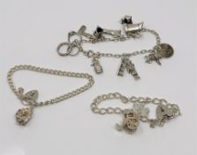 Three silver charm bracelets CONDITION REPORT: 55.