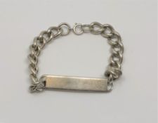 A silver identify bracelet, length 23cm. CONDITION REPORT: 53.