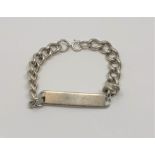 A silver identify bracelet, length 23cm. CONDITION REPORT: 53.