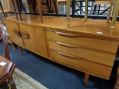 A mid century teak bow-fronted sideboard