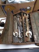A concertina metal tool box containing spanner and socket tools