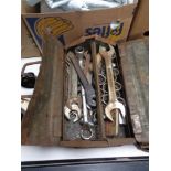 A concertina metal tool box containing spanner and socket tools