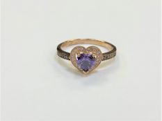 A silver heart shaped dress ring, size P1/2.