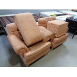 A pair of peach upholstered armchairs and a footstool