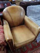 An antique style tan leather armchair