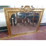 An antique gilt framed overmantel mirror