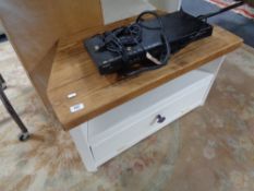 A painted reclaimed wood TV stand and a DVD player
