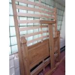 A 4'6" pine bed frame