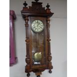 A Victorian mahogany wall clock with enamelled dial and pendulum