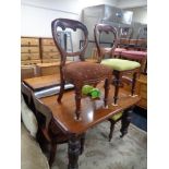 A Victorian mahogany extending table with two leaves and a harlequin set of six dining chairs