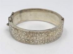 A silver bangle with engraved decoration, Birmingham 1967 CONDITION REPORT: 29.