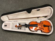 A modern 3/4 size violin in case with bow