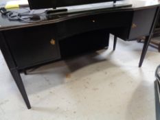 A contemporary kneehole desk with leather insert