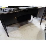 A contemporary kneehole desk with leather insert
