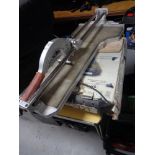 A wet tile saw and a further tile cutter